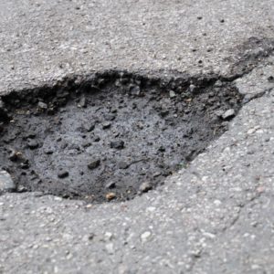 a pothole on sidewalk